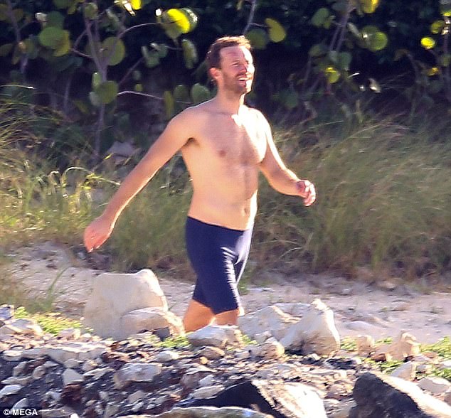 By TRACY WRIGHT FOR DAILYMAIL.COM Shirtless Chris Martin soaks up the sun i...